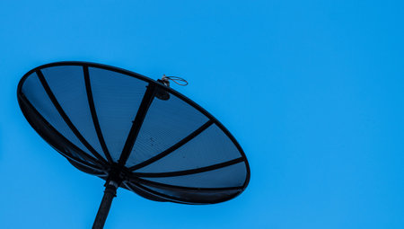 satellite dish with clear blue skyの写真素材