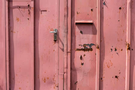 old red metal doorの写真素材