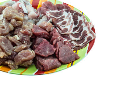 Mixed meat in colorful ceramic plateの写真素材