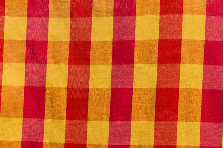 Fabric background cells of red,orange and yellowの写真素材