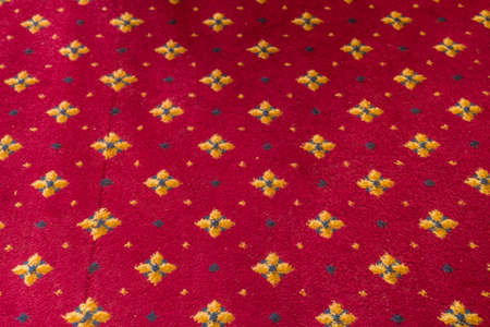 Red fabric with yellow tips textureの写真素材