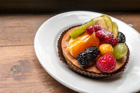 fresh fruit pie tart with kiwi, blueberry, orange and strawberryの写真素材
