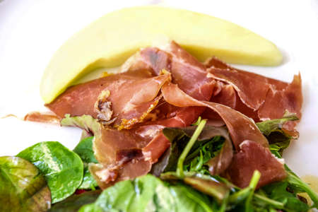 Ham with melon in french restaurantの写真素材
