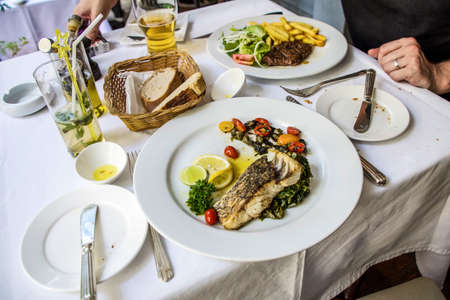 Fish steak,french food in the restaurantの写真素材