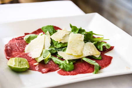 beef carpaccio on white dishの写真素材