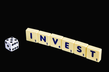 Financial concept,scrable  invest text with diceの写真素材