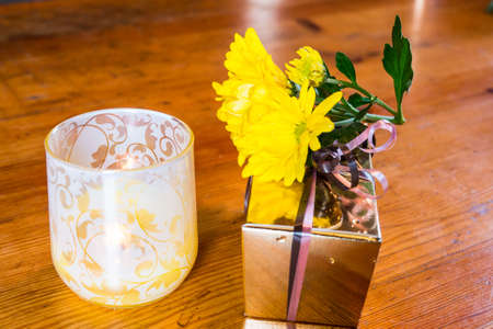 Present with flower on the table.の写真素材