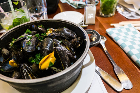 Steamed mussels in white wine sauce.の写真素材