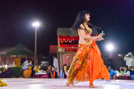 Dubai, United Arab Emirates -November 6, 2015: beautiful belly dancer performing a "Belly Dance".のeditorial素材