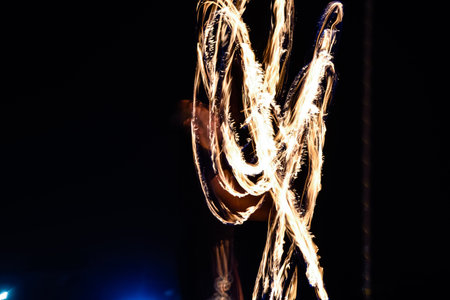 Dubai, United Arab Emirates - November 6, 2015: Fire dancer performing at Dubai Desert Safari.