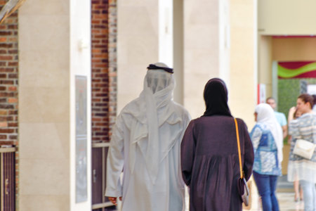 Dubai, United Arab Emirates -November 7, 2015: muslim couple in department store - back view.のeditorial素材