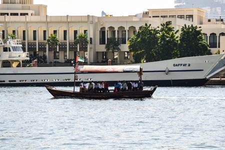 Dubai, United Arab Emirates -November 6, 2015:People on traditional abra ferries on November 6,2015...