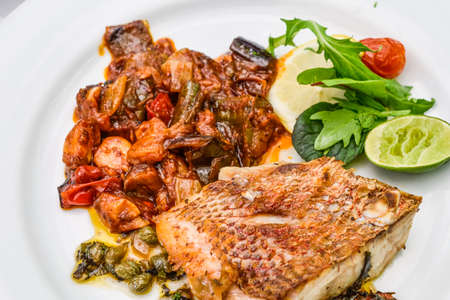 Bar a la plancha et ratatouille, french food.の写真素材