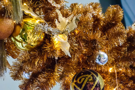 xmas tree ornaments on gold xmas tree.の写真素材