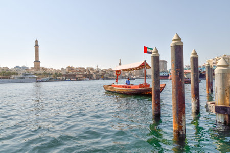 Dubai, United Arab Emirates -November 6, 2015:People on traditional abra ferries on November 6,2015 in Dubai, UAE. Shipbuilding technology is unchanged from the 18th century.のeditorial素材