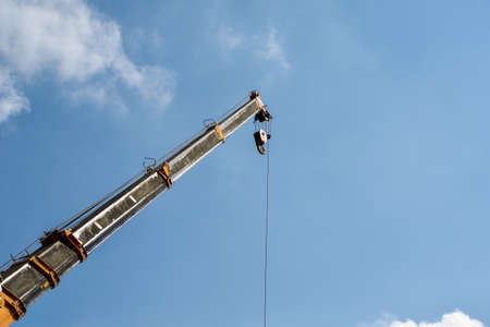 construction crane on blue sky background.の写真素材