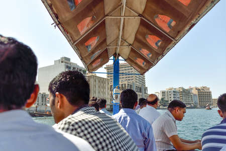 Dubai, United Arab Emirates -November 6, 2015:People on traditional abra ferries on November 6,2015 in Dubai, UAE. Shipbuilding technology is unchanged from the 18th century.のeditorial素材