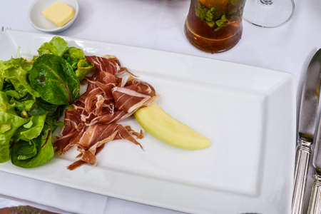 melon, prosciutto and salad.の写真素材