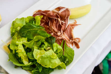 melon, prosciutto and salad.の写真素材
