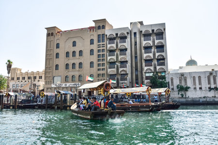 Dubai, United Arab Emirates -November 6, 2015:People on traditional abra ferries on November 6,2015 in Dubai, UAE. Shipbuilding technology is unchanged from the 18th century.のeditorial素材