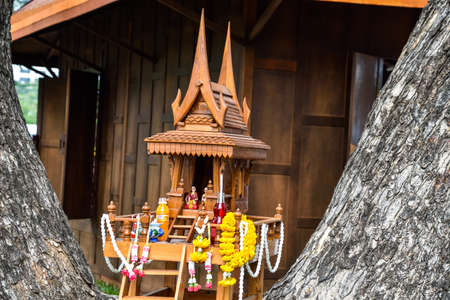 Thai traditional wooden spirit house.の写真素材