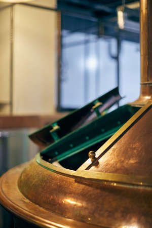 Equipment for the production of handicraft beer. Wort cooking and filtration copper tank. Front view.の写真素材