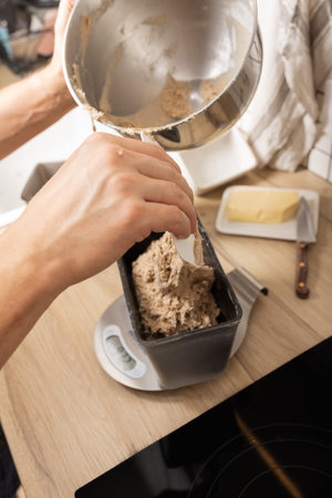 The process of making rye bread. The dough on the rye bread is laid out in a mold. Top view.