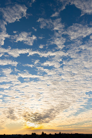 A deep sunset blue sky with clouds. Front view. Russia.