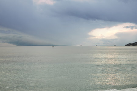 Landscape with sea and ships in winter. Russia, Black Sea. Front view.
