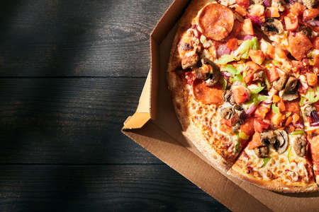 A box of pizza on a summer day. Pizza delivery concept. Top view. Flat lay.の写真素材