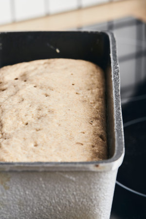 The process of making rye bread. The dough on the rye bread is laid out in a mold. End of dough...