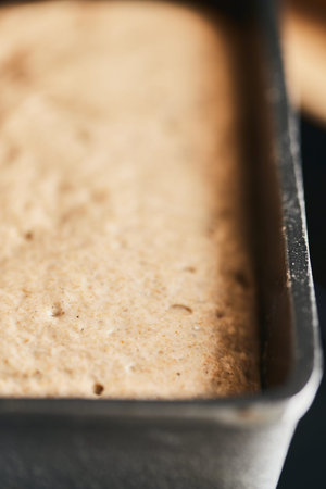 The process of making rye bread. The dough on the rye bread is laid out in a mold. End of dough...