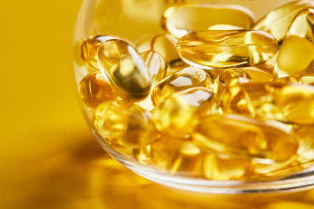 Omega-3 fatty acid capsules on a blue background in a flask. The concept of medicine and healthy...