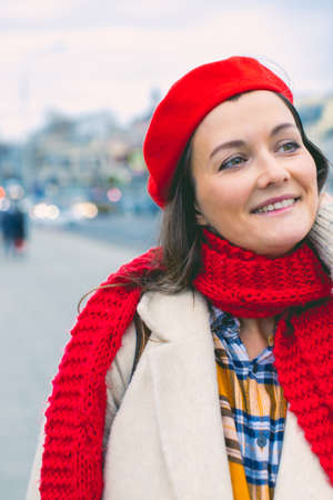 Portrait of a young attractive woman, hello autumn, the beginning of the season. Vertical photo.の写真素材