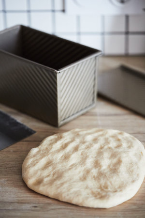 The process of making homemade toast bread in a mold. The concept of healthy homemade food. Vertical...