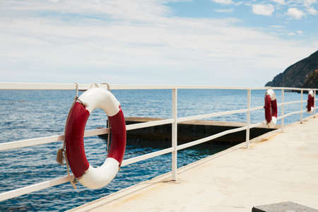 Black Sea embankment with life buoys. Front view.の写真素材