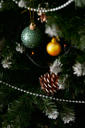 Decoration of the Christmas tree for holidays, cones, balls, garlands, beads. Front view.