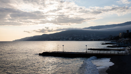 Winter sea, a wave runs over the beach in Yalta. Front view.の写真素材