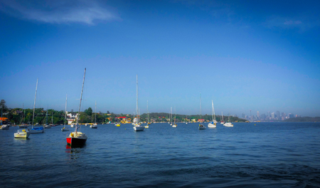 the sail boat parks in the sea in the famous bay of Sydney. with the clearly blue skyの写真素材