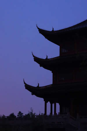 Silhouette of the ancient Chinese architecture at sunset, China.の写真素材