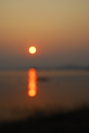 Beautiful view shadows Light Long-tailed boat sunrise in dam Srinakarin National park Kanchanaburi, Thailandの写真素材