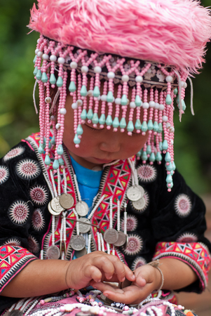 CHIANG MAI, THAILAND - OCTOBER 25 : Portrait of unidentified Akha hill tribe children with traditional at Wat Phratat Doi Suthep on OCTOBER 25, 2009 in Chiang Mai, Thailand.のeditorial素材