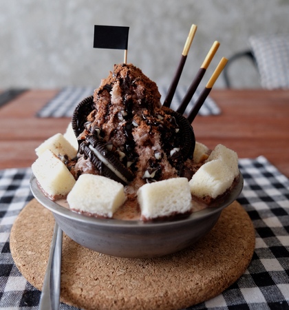 Shaved ice with syrup and milk, chocolate, strawberryの写真素材