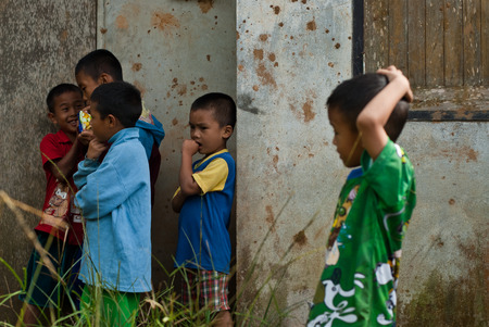 CHIANG MAI THAILAND - OCTOBER 23 : unidentified children eat snacks in their village on OCTOBER 23, 2009 in CHIANG MAI, THAILANDのeditorial素材