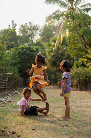 CHAMPASAK, LAOS - FEBRUARY 26 : Unidentified Children of Laos play and fun of kids in countryside village on FEBRUARY 26, 2011 in Champasak, Laosのeditorial素材