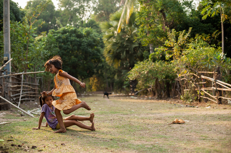 CHAMPASAK, LAOS - FEBRUARY 26 : Unidentified Children of Laos play and fun of kids in countryside village on FEBRUARY 26, 2011 in Champasak, Laosのeditorial素材