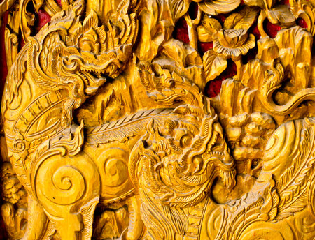 Traditional Thai style art on temple's wall, Thailandの写真素材