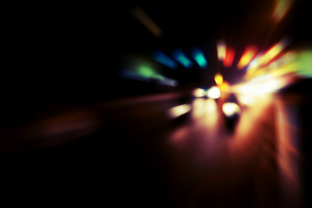 Blurry Illumination and night lights, car traffic motion blur the speed and dynamicsの写真素材