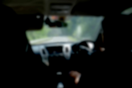 blurred image of people driving car on day timeの写真素材