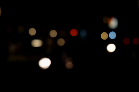 Abstract urban night light bokeh, defocused backgroundの写真素材